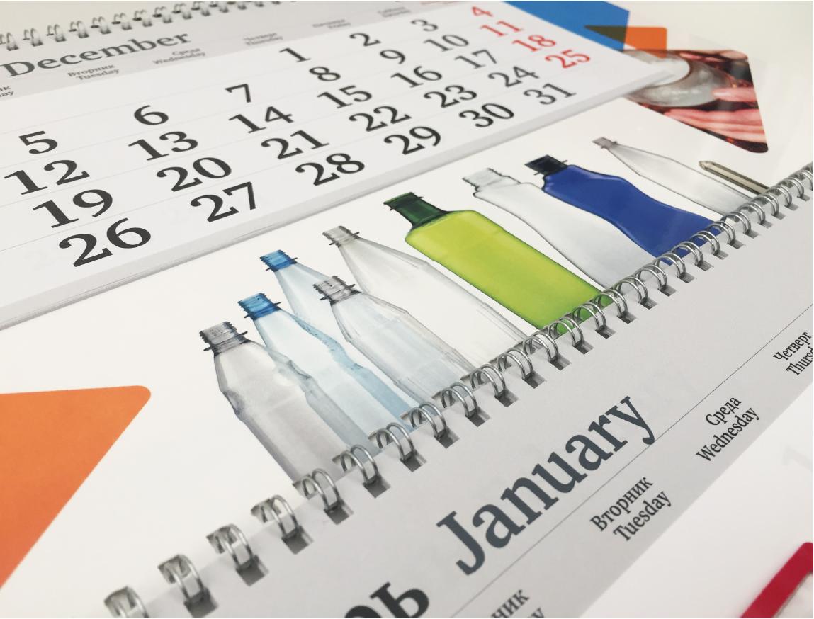 Рекламные поля календаря оформлены фотографиями продукции компании и фирменным орнаментом